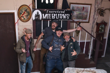 Photograph of 4 men smiling