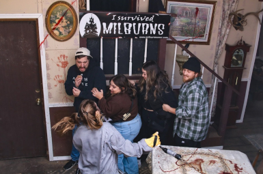 Photograph of scared 2 men and 2 women