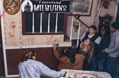 Photograph of scared 4 women and 1 man